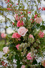 landscape with a floral arrangement of various roses