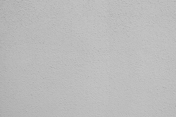 Surface texture of a plain gray wall with a subtle rough finish