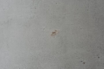 Close-up of a weathered gray surface with minor imperfections and textures