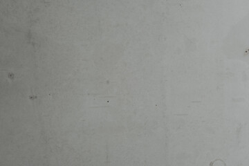 Simple gray concrete wall with subtle texture and slight imperfections visible