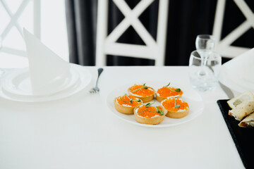 Delicious dessert tartlets served at a modern dining table during midday