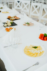 Elegant dining table set with assorted dishes and decor in bright atmosphere