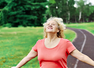 woman mature fitness dreaming relaxation exercise wellbeing meditating freedom inhaling carefree...