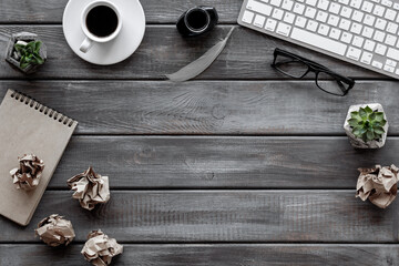 Lumps paper drafts with books and inkwell. Concept of creativity and inspiration. Writer or blogger working space desktop