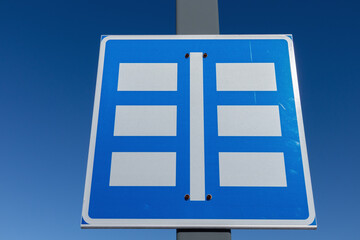 parking lot sign against blue sky
