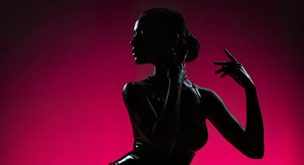 Silhouette of Woman Posing Against Red Background