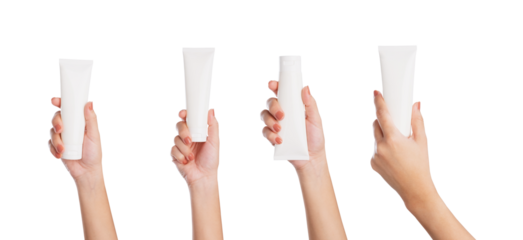 Female hand holding blank cosmetic bottle isolated on white background