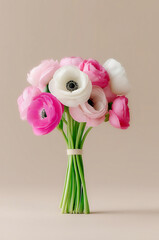 Bouquet of ranunculus on a beige background