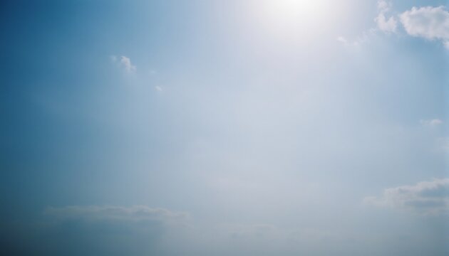 Blue Sky with Clouds: A tranquil image showing an expansive blue sky gently diffused with a few soft clouds, offering a sense of calmness, peace, and endless possibilities.