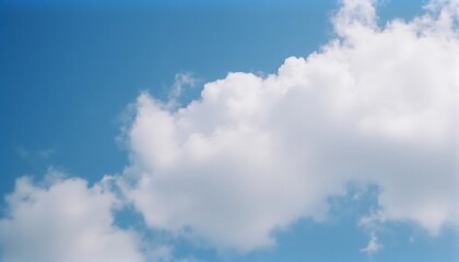 Obraz premium Azure Skies and Fluffy Clouds: Capturing the serenity of a cloudscape with a bright blue sky and soft, fluffy clouds, evoking a sense of peace and endless possibilities. 
