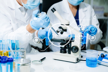 Modern medical research laboratory. female scientist hands working with micro pipettes analyzing...