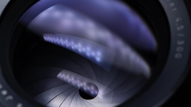 Camera lens close up. Opening and closing aperture. Light reflections. Movement. Large format professional camera