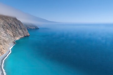 Obraz premium Coastal panorama with rugged cliffs and turquoise water