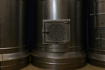 Casings for round metal stoves and fireplaces