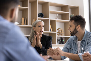 Speaking from experience. Seasoned older adult businesswoman in formal suit lead business training...
