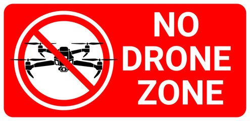 A bold red sign with a prohibition symbol over a drone icon, clearly marking a "No Drone Zone." Ideal for safety, security, or restricted-area signage
