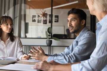 Company executive analyst making report at meeting, business team people listen to project manager....