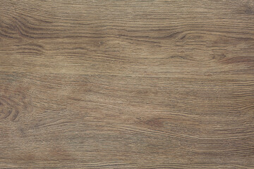 Light brown wood grain texture background showing growth rings