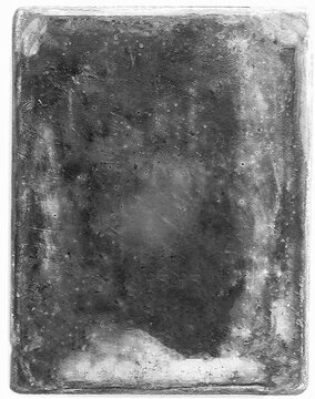 Old worn damaged tintype showing signs of age and decaying