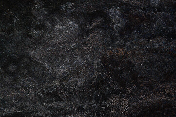 Dark grunge texture background showing dust and scratches with light leaks