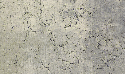 Cracked concrete surface showing signs of aging and distress