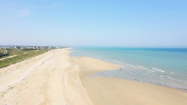 The soft sand of Utah Beach faces infinity in Europe, France, Normandy, near Carentan, in spring, on a sunny day.&nbsp;