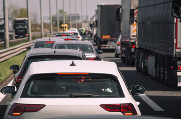 Traffic jam on highway cars and trucks in heavy traffic