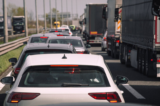 Traffic jam on highway cars and trucks in heavy traffic