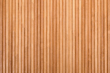 Parallel wooden slats forming warm brown textured background