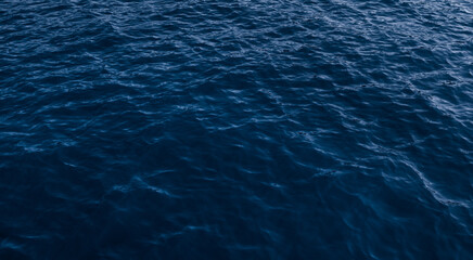 Dark ripple water surface, blue ocean texture background