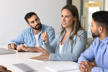 Education at workplace. Confident mid aged lady business trainer mentor coach speak on corporate...