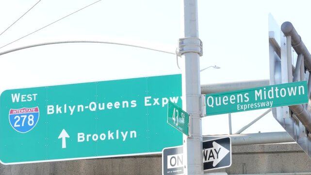 Brooklyn Queens expressway road sign, New York City highway signage, green traffic roadsign shield, United States transportation. One way arrow. Queens Midtown signboard.