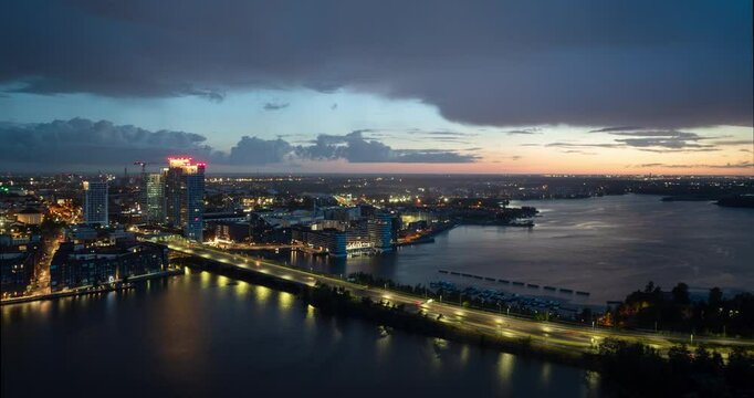 Aerial hyperlapse around the illuminated Kalastama district of Helsinki, dusk