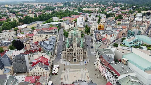 Central square of Liberec with majestic town hall shown from cinematic aerial
