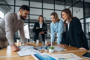 Power management in wind turbine company. Business people are working in the office