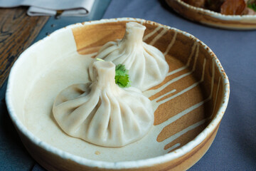 Georgian khinkali or chinkali with minced meat. Traditional spicy Georgian steamed dumplings