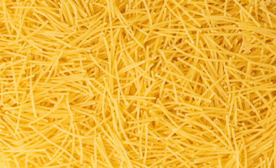 Raw vermicelli textured background, gold soup pasta pattern, small homemade noodles mock up