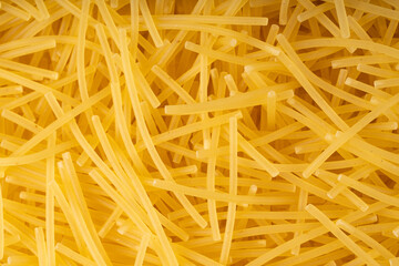 Raw vermicelli textured background, gold soup pasta pattern, small homemade noodles mock up