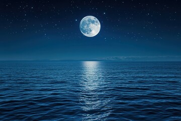 Full moon over ocean water reflecting light creating a bright path.