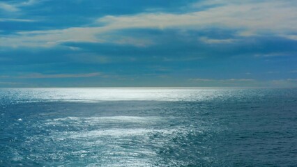 Fototapeta premium The tranquil beauty of a sunset on the vast ocean.