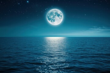 Full moon shines over a dark ocean creating a bright reflection on water.
