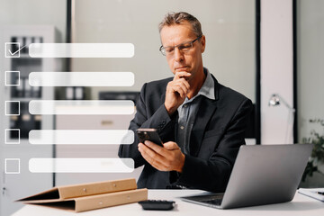 Business performance checklist concept, businessman using tablet and laptop doing online checklist...