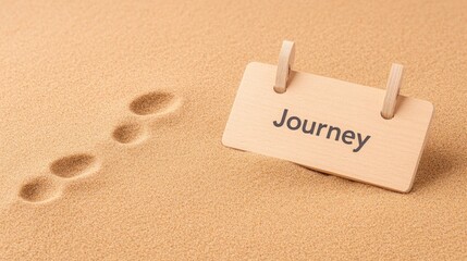 Wooden sign with the word Journey in sand with footprints symbolizing travel adventure
