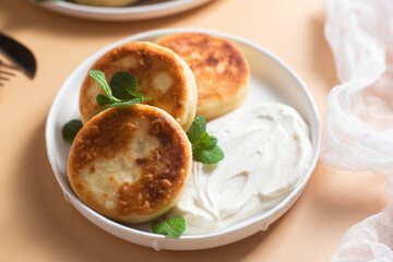 Homemade cottage cheese pancakes with sauce 