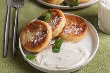 Homemade cottage cheese pancakes with sauce 