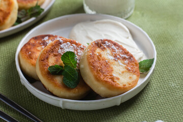 Homemade cottage cheese pancakes with sauce 