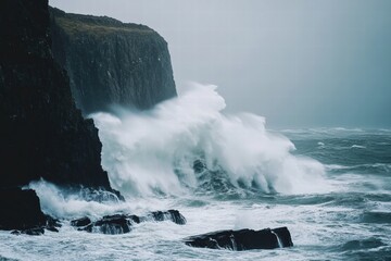 Obraz premium Huge crashing wave on rocky coastline