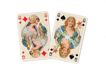 A pair of vintage playing cards of the same value isolated on a white background.