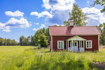 Old croft with an overgrown garden in the summer © Lars Johansson
