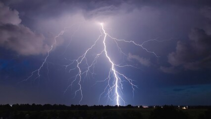 Massive electrical storm with lightning strikes over a field, under darkened sky.